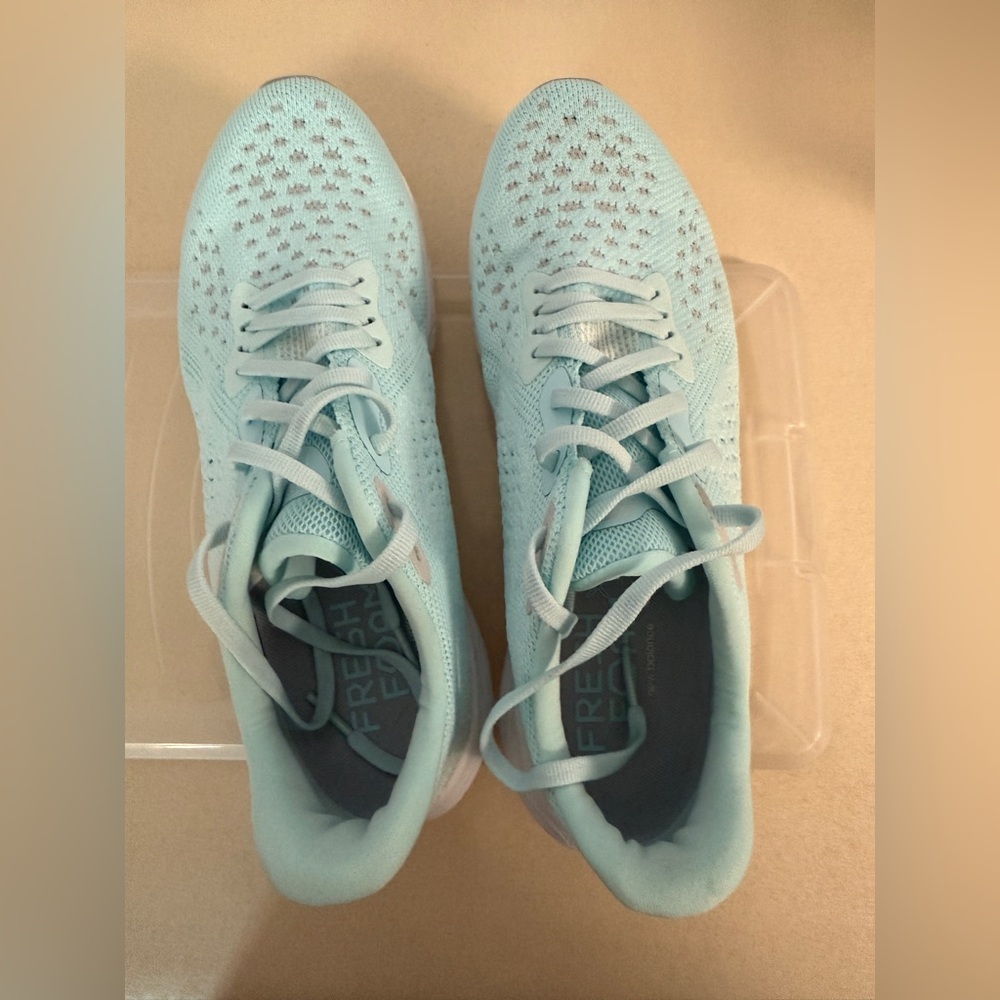 New Balance women’s size 8.5, blue and grey sneakers.